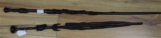 Two African carved ebony walking sticks